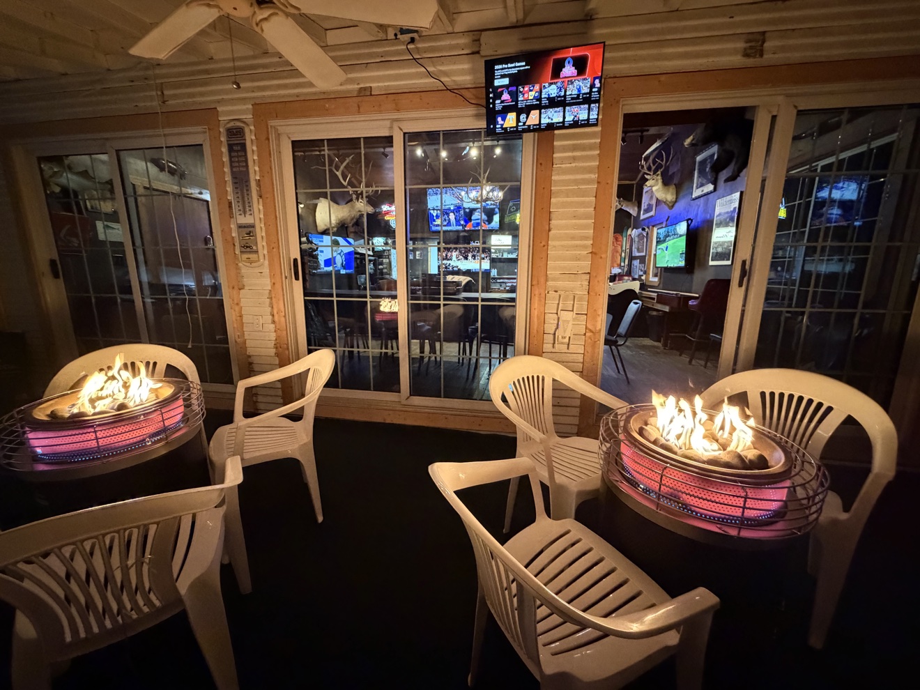Porch with fire tables at night