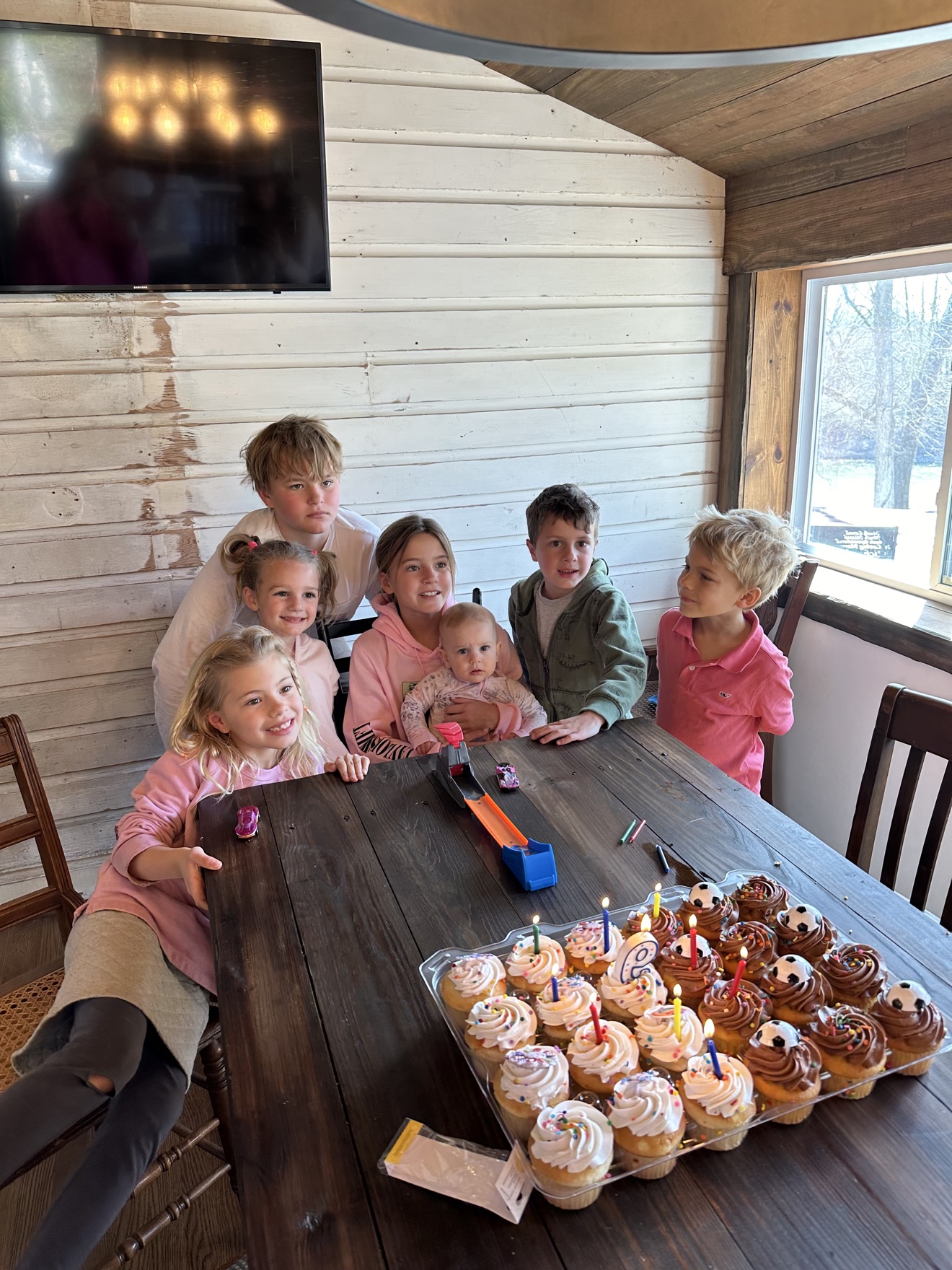Kids with birthday cupcakes